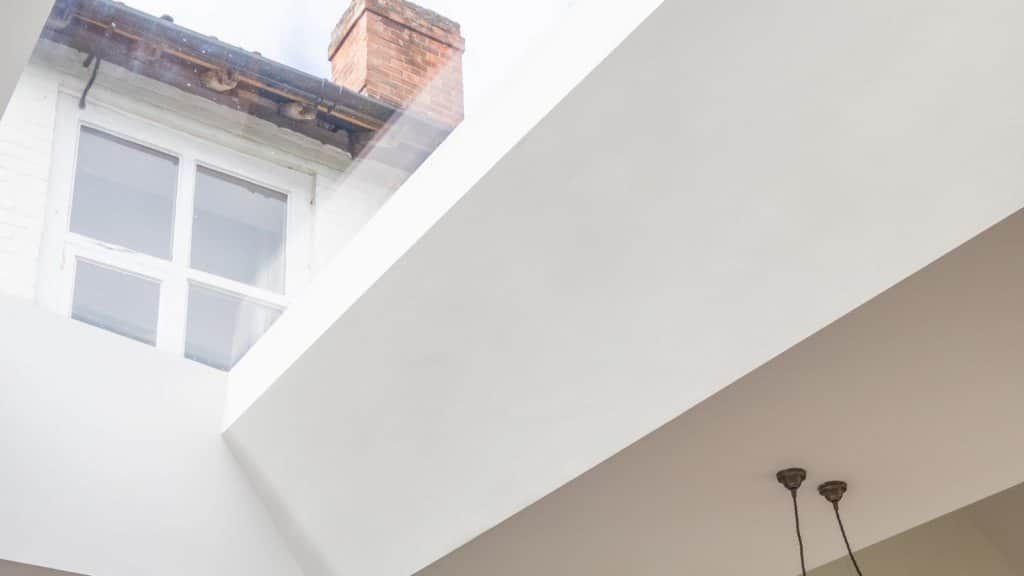 Close up photograph of a Flushglaze rooflight next to white walls