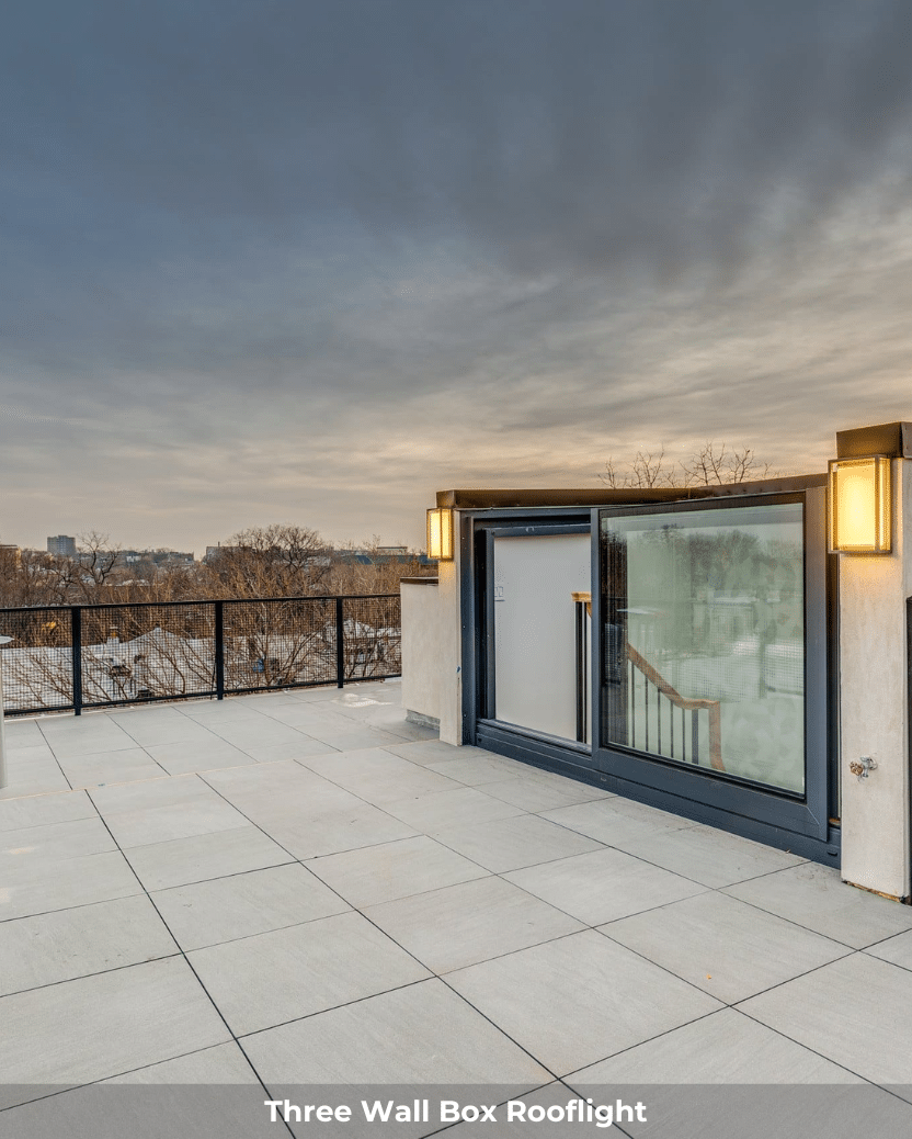 three walled box rooflight installed on a white modern roof terrace, sunset in the background