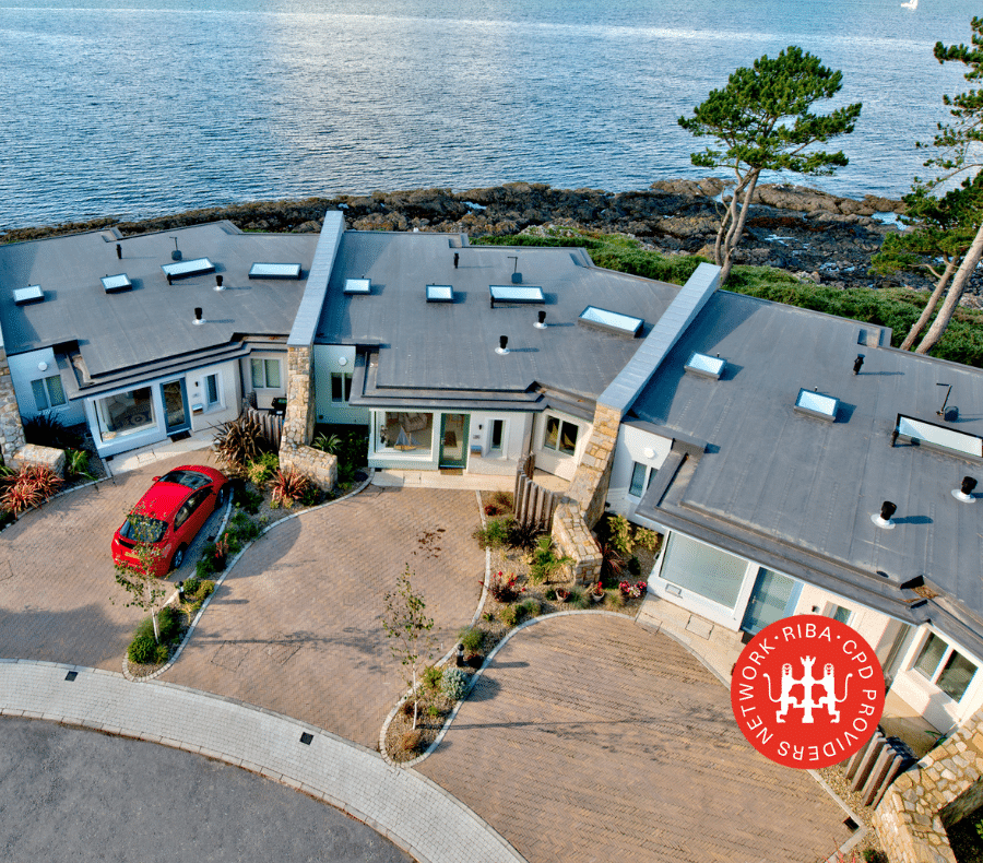 flat roof rooflights installed on a row of houses by the sea