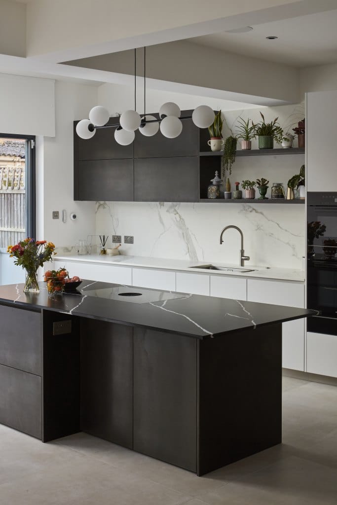 Modern kitchen counters, island and cabinets in renovated kitchen extension.