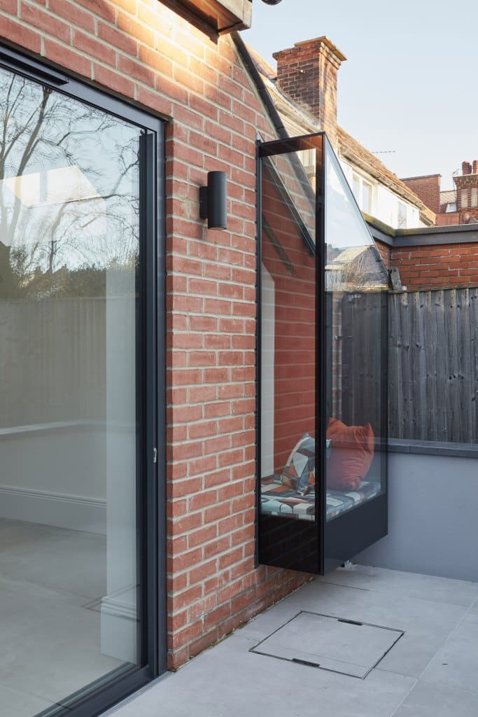 Patio doors, brick walls and glass extension.